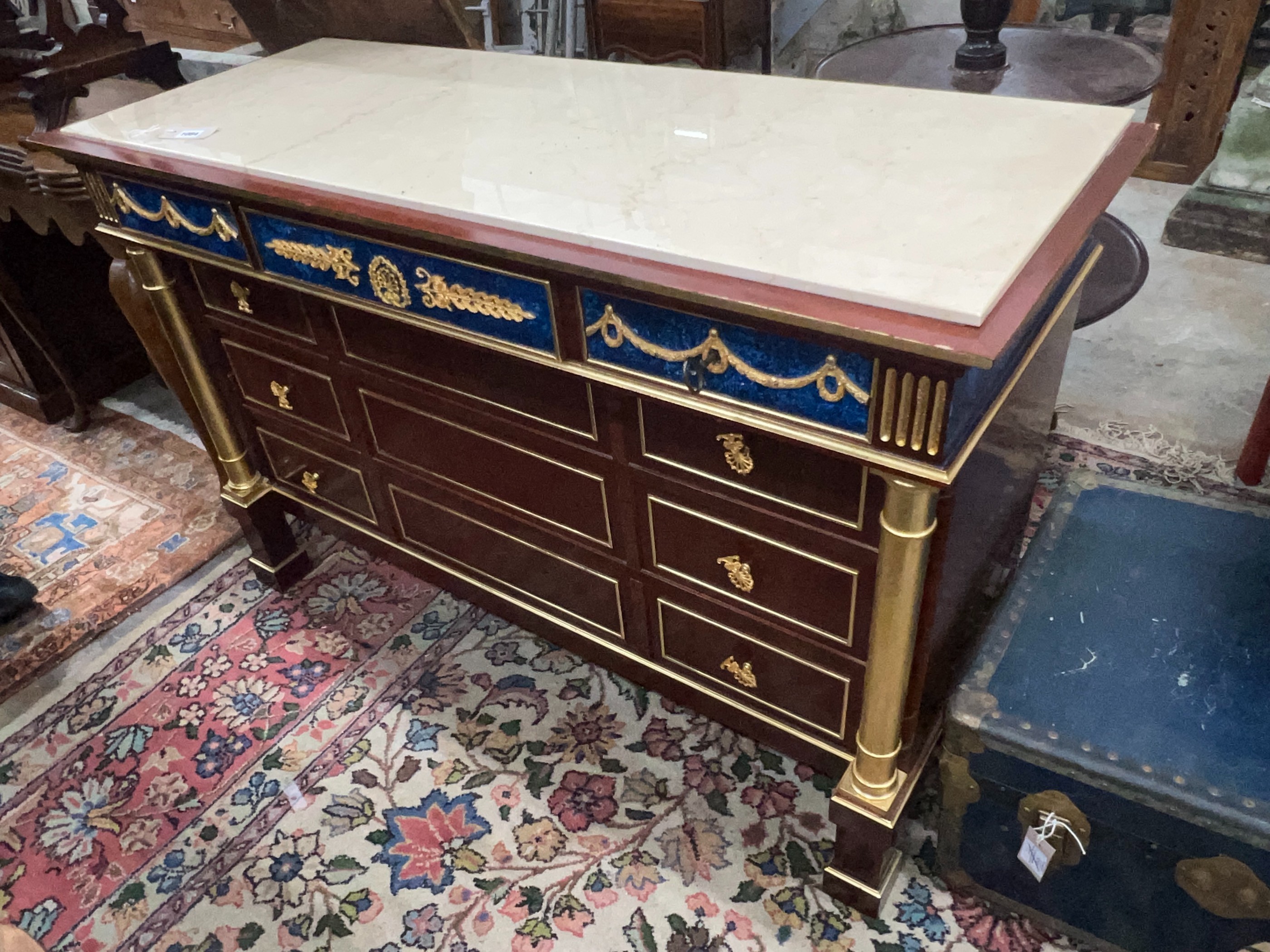 An Empire style faux malachite parcelgilt mahogany marble top commode, width 130cm, depth 50cm, height 85cm